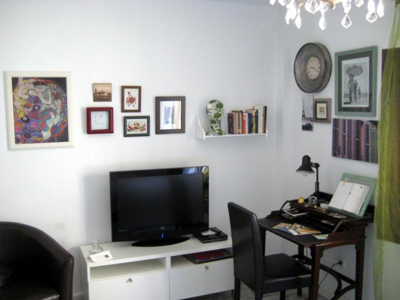 TV, library and desk with city information